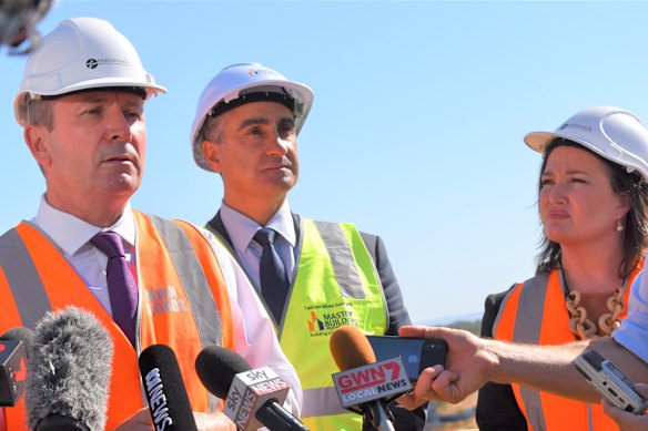 Master Builders Association executive director John Gelavis (centre). 