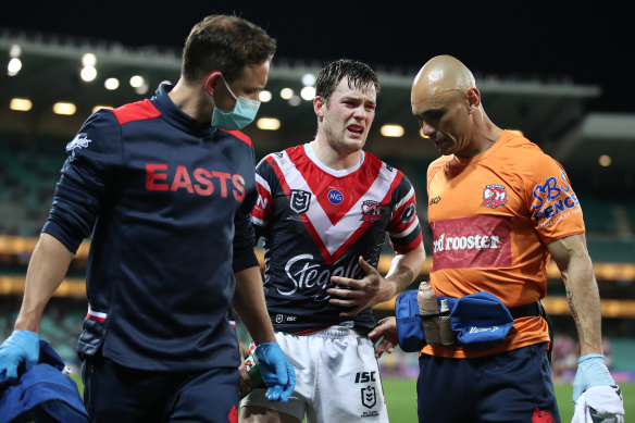 Luke Keary is helped from the field on Thursday.