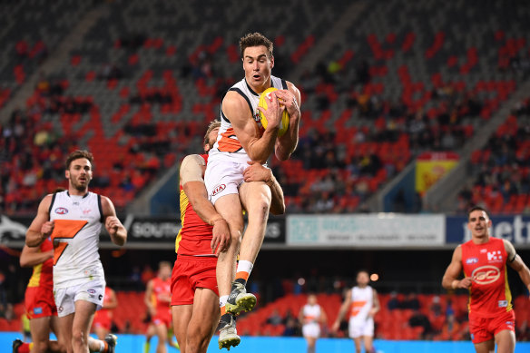 Giant leap: Jeremy Cameron flies for a mark against Gold Coast in his Coleman Medal-sealing performance. 