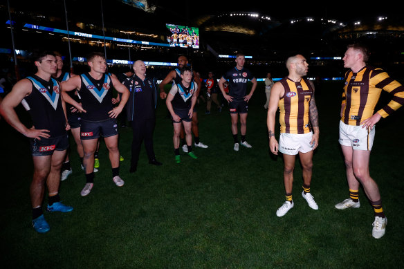 Power coach Ken Hinkley clashes with Hawthorn skipper James Sicily post-match.