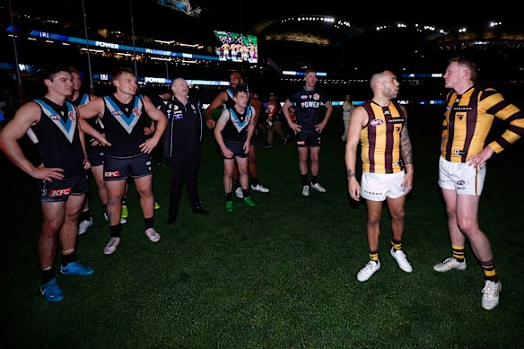Power coach Ken Hinkley clashes with Hawthorn skipper James Sicily post-match.