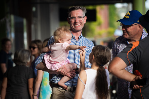 NSW Premier Dominic Perrottet with his daughter Celeste in Lismore earlier this month.