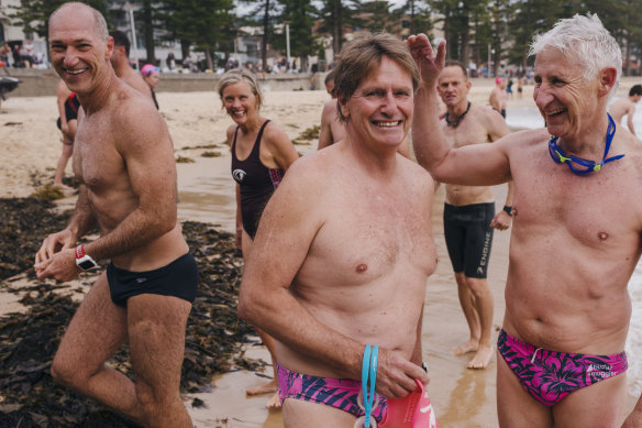Bold and Beautiful swim club key volunteer Ian Forster (centre) at Manly Beach in December 2018. 