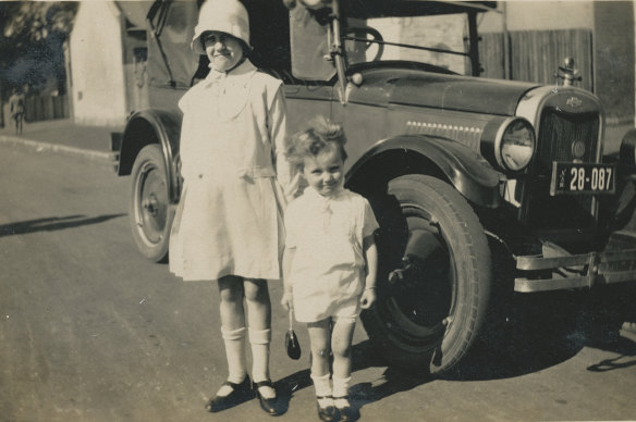 Three-year-old Marie with her cousin Pearl, 11, at the corner of Salisbury Road and Denison Street, Camperdown, 1928.
