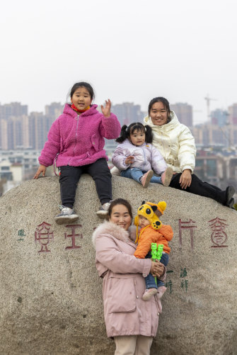 Xu Zhenzhen with her girls: “Taking care of children every day is too boring,” she says. “I hope my daughters can pursue their own dreams.”