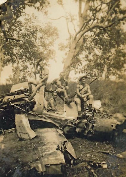 Reg Chard (centre, top) on debris.