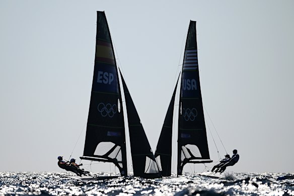 Diego Chever and Florian Trittel Paul of Spain and Ian Barrows and Hans Henken of the United States in action during the men’s skiff 49er class medal race.