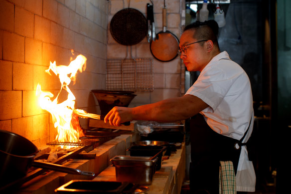 Co-founder and chef Raymond Hou works the new grill at Firepop, Enmore.
