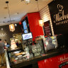 Retail Food Group, owner of Michel's Patisserie, has seen its profits drop over 50 per cent.