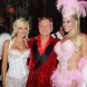 Holly Madison, on the left, pictured with Hugh Hefner and Anna Nicole Smith in 2004, said she was groomed and abused by the Playboy magazine founder. 