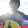 Demonstrators hold Kanak and Socialist National Liberation Front (FLNKS) flags during a gathering in Paris.