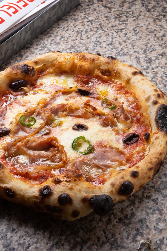Australiani pizza with pancetta, olives and chilli.