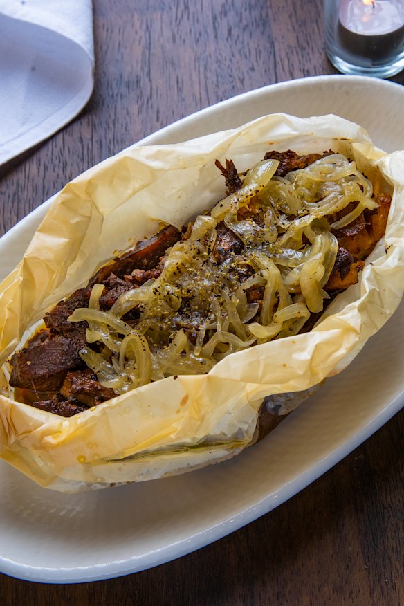 Goat is baked in the oven in parchment paper.
