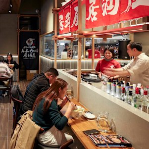 The space seats 150, with a bar for solo diners and booths for groups.