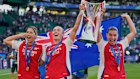 Arsenal’s Australian contingent of Kyra Cooney-Cross, Caitlin Foord and Steph Catley celebrate their Champions League final win.