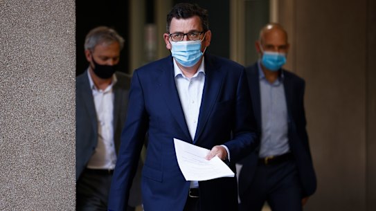 Premier Daniel Andrews (centre), Chief Health Officer Brett Sutton (left) and COVID-19 response commander Jeroen Weimar this week.