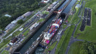 A cargo ship traverses the Panama Canal.