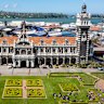Dunedin station … “a croquembouche of basalt and limestone arches and turrets”.