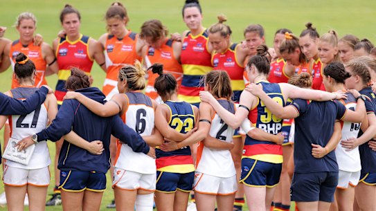 Players from both sides pause to remember former Giant Jacinda Barclay during a pre-season match between the Crows and GWS Giants earlier this month.