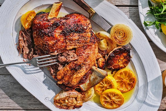 Roasted garlic, onion and lemon become the dressing for this simple lamb roast.