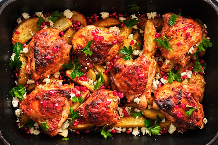 Danielle Alvarez’s yoghurt-marinated chicken tray bake and potatoes, feta and pomegranate.