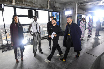 Designers Mario-Luca Carlucci (left) and Peter Strateas perform checks at rehearsals for their show at Melbourne Fashion Week.