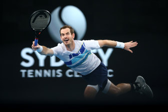 Andy Murray stretches for a forehand return in his win over Reilly Opelka.
