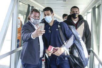 A man takes a selfie photograph with Serbian tennis player Novak Djokovic after his arrival in Belgrade, Serbia.