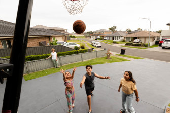 Marian Peters with her children, Emilio, 12, Estelle, 10, and Martina, 8, in Colyton in western Sydney, an area in dire need of more green spaces. 