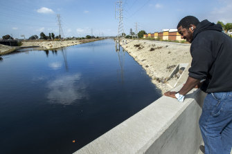 Richard Mootry, a local worker, looks out at the Dominguez Channel, the source of a foul odour in Carson, California.