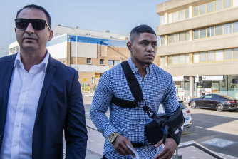 Manase Fainu, right, arrives at Liverpool police station in 2019 along side his manager Mario Tartak.