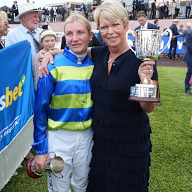 Jamie Melham and Janice McKenna celebrate an emotional moment at Caulfield.