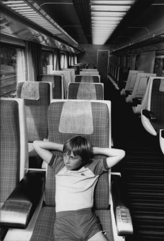Scott Finch, 9 of Woy Woy inside one of comfortable carriages-looking very much towards travelling in class for change. February 1, 1982. 