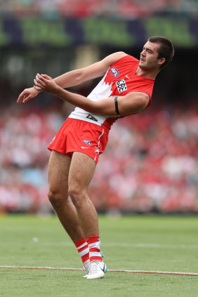 Logan McDonald, five goals, rides ones of his shots on goal home against Hawthorn.