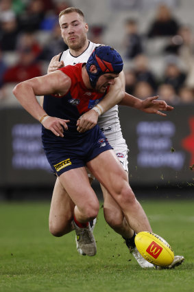 Harry McKay tackles Angus Brayshaw.