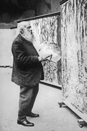 Claude Monet at work on  monumental waterlilies paintings  in his studio in Giverny c. 1920.