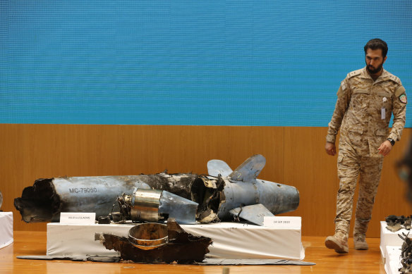 A Saudi military officer walks next to what was described as a misfired Iranian cruise missile.