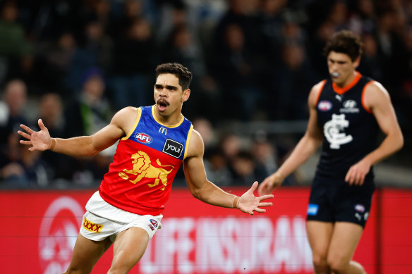 Charlie Cameron celebrates one of his four goals for the Lions in their win over Carlton.