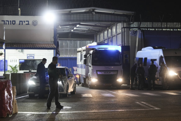 An Israeli prison transport vehicle carries Palestinian prisoners released from Ofer military prison near Jerusalem.