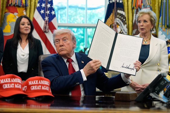 US President Donald Trump signs an executive order in the Oval Office on April 23.