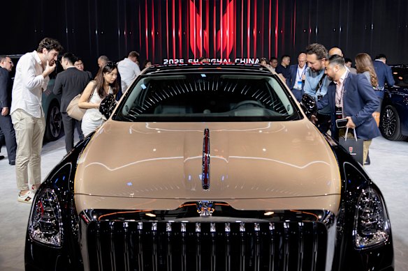 Visitors view the luxury China-made Red Flag car.