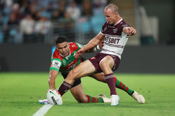 Cody Walker scores the opening try as Daly Cherry-Evans tries to shepherd the ball over the dead-ball line.