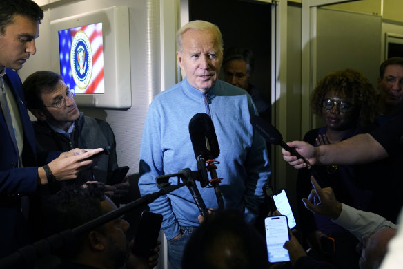 US President Joe Biden speaks to the media on Air Force One.