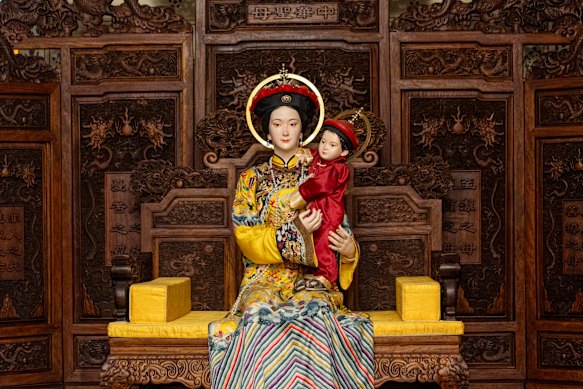 A wax statue of the Chinese Holy Mother and son in Manchurian dress from the Qing dynasty era inside the Xishiku Church in Beijing. 