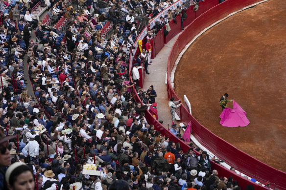 Spectators watch a bullfight at the Plaza Mexico.