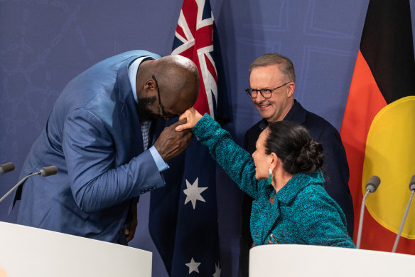 Indigenous Affairs Minister Linda Burney stretches her hand out to former basketballer Shaquille O’Neal.