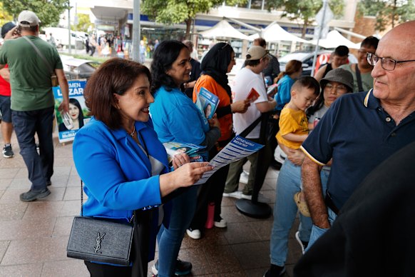 Liberal candidate Carmen Lazar meets voters in Fairfield, where she used to be a Labor councillor and volunteer for Bowen’s campaigns.