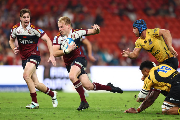 Tom Lynagh of the Reds runs the ball during the round seven Super Rugby Pacific match.