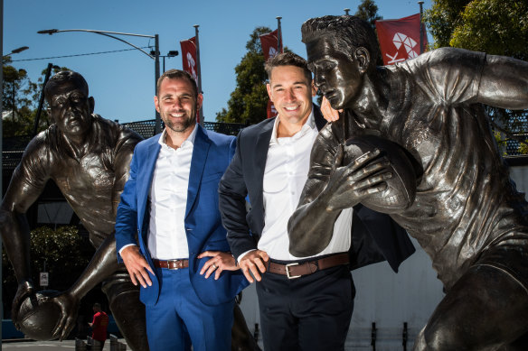 Storm legends Cameron Smith (left) and Billy Slater with their statues at AAMI Park.