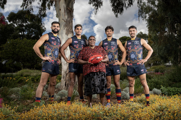 Adelaide players and artist April Napangardi Campbell with the Crows’ Indigenous jumper.